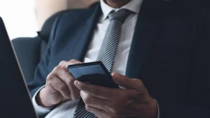A gentlemen using Second Phone Number Line.
