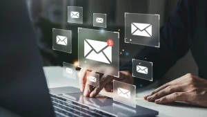 Person checking email-to-text features on a laptop with email. (Graphical Representation) 