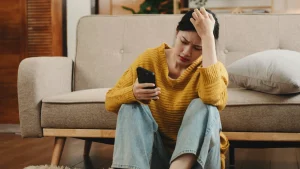 A girl trying to figure out the Psychology of not responding to text messages.