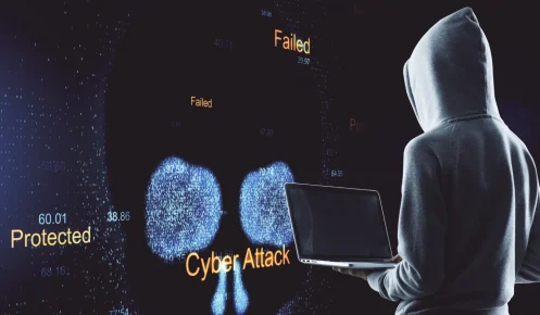 Person In A Hoodie Holding A Laptop Faces Cyber Threat